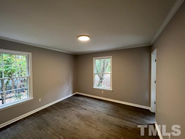 3600 Star Trek Court Raleigh, NC 27604 - Photo 19 of 25 an empty room with wooden floor and windows