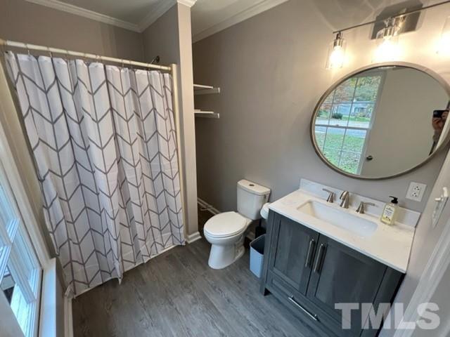 3600 Star Trek Court Raleigh, NC 27604 - Photo 20 of 25 a bathroom with a sink toilet and mirror