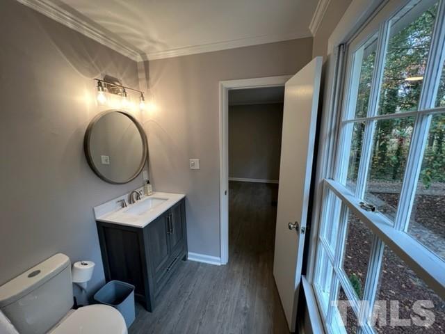 3600 Star Trek Court Raleigh, NC 27604 - Photo 21 of 25 a bathroom with a toilet mirror vanity and sink