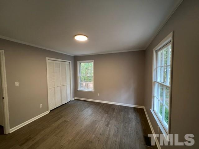 3600 Star Trek Court Raleigh, NC 27604 - Photo 22 of 25 an empty room with wooden floor and windows