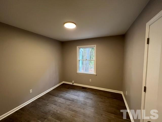 3600 Star Trek Court Raleigh, NC 27604 - Photo 24 of 25 an empty room with wooden floor and windows
