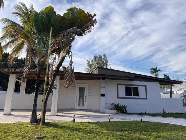 a house view with a garden space