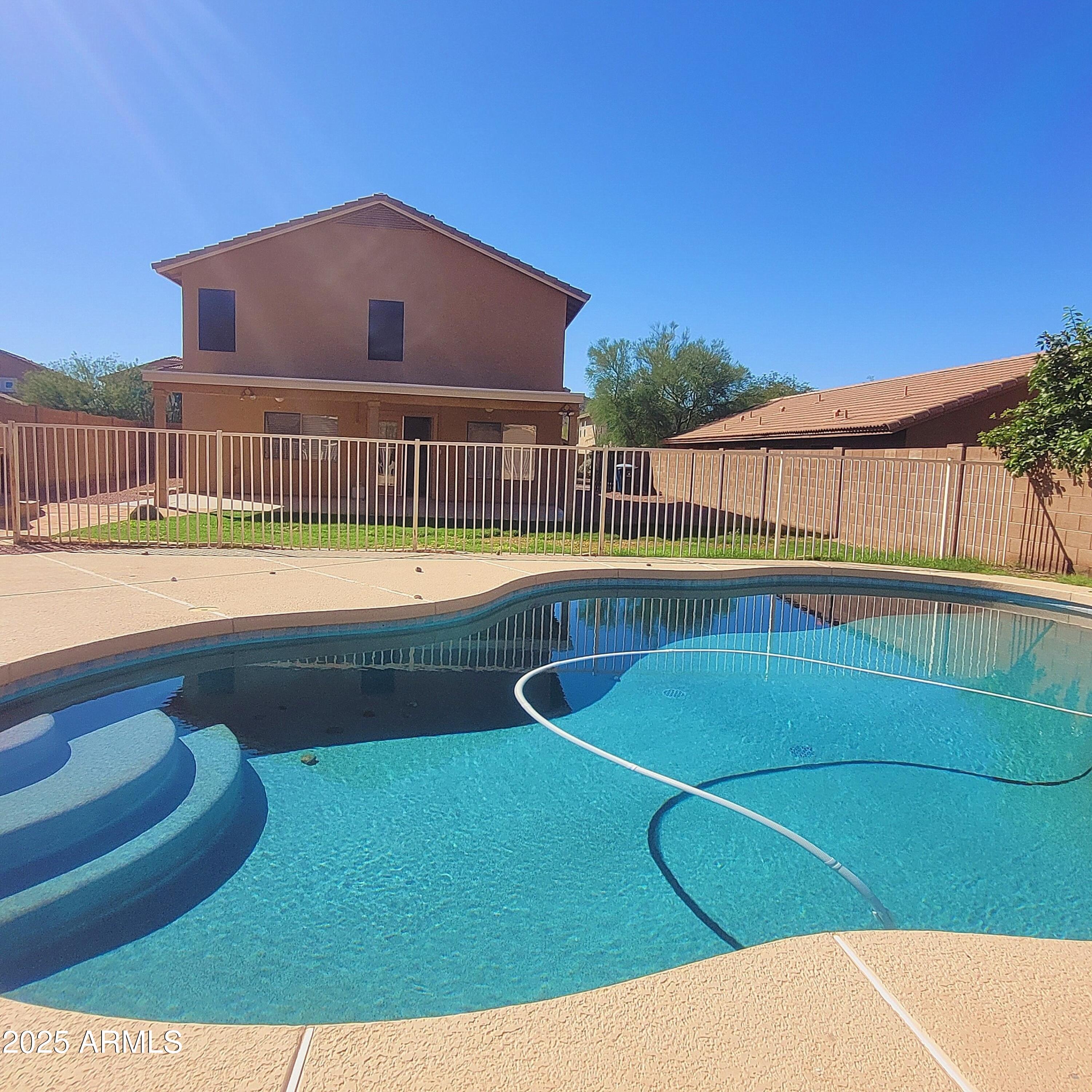 2210 East Paraiso Drive Phoenix, AZ 85024 - Photo 25 of 30 a view of a swimming pool with an outdoor seating