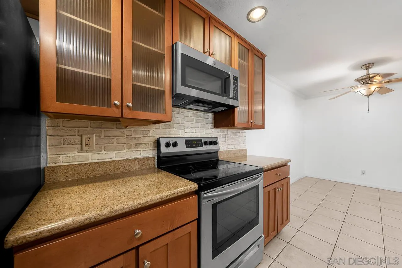 174 Chambers Street, Unit 1 El Cajon, CA 92020 - Photo 12 of 37 a kitchen with a sink and a stove top oven