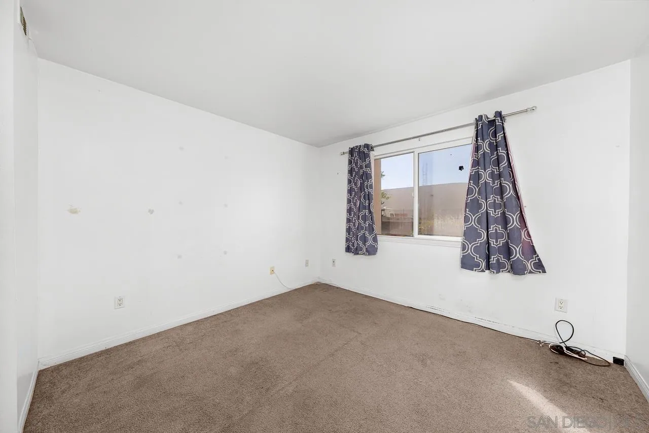 174 Chambers Street, Unit 1 El Cajon, CA 92020 - Photo 15 of 37 a view of a room with window and a ceiling fan
