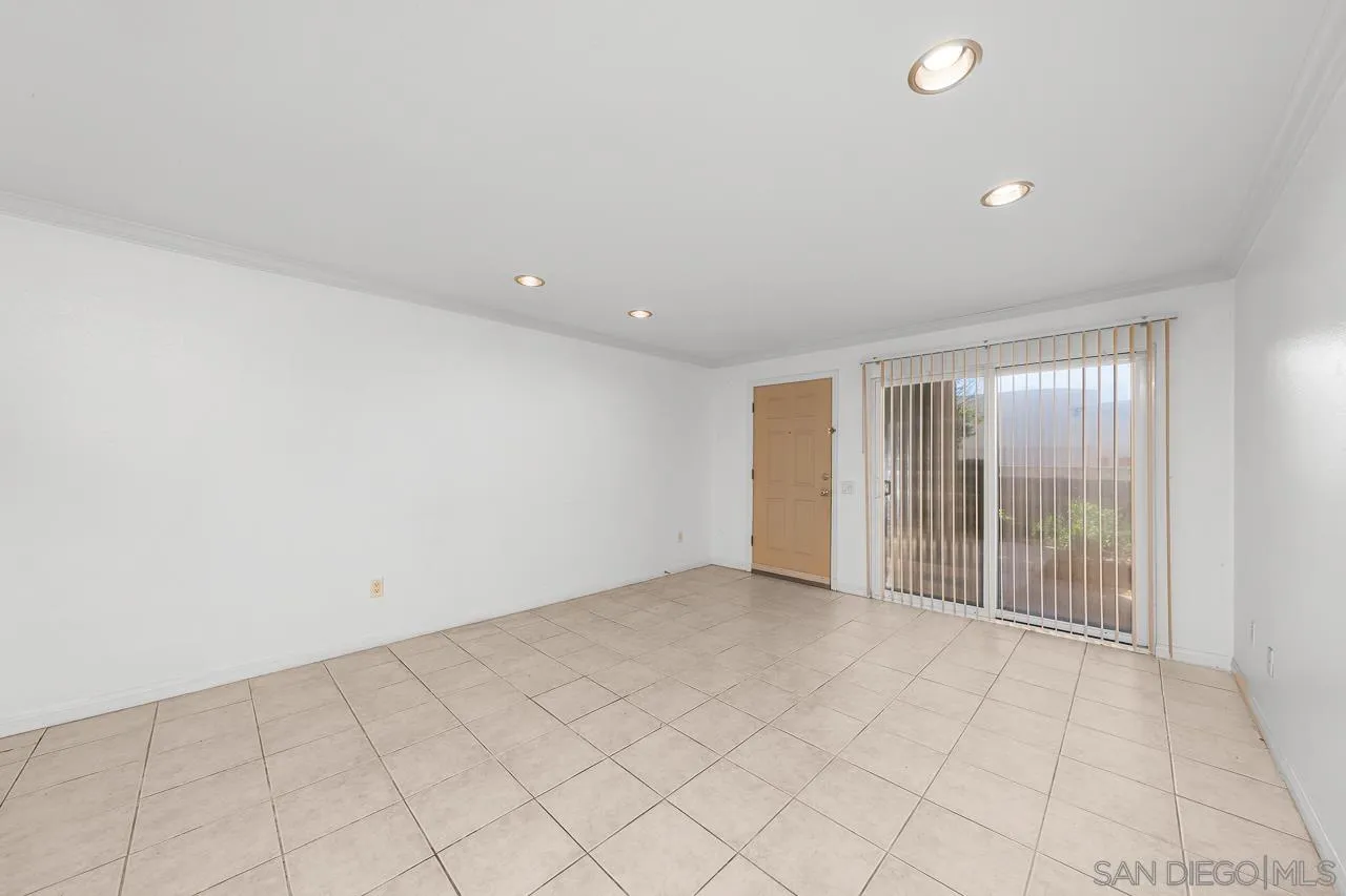 174 Chambers Street, Unit 1 El Cajon, CA 92020 - Photo 5 of 37 an empty room with sliding door