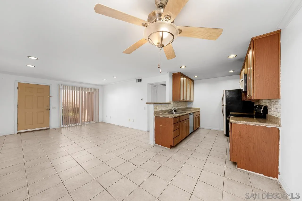 174 Chambers Street, Unit 1 El Cajon, CA 92020 - Photo 7 of 37 a kitchen with stainless steel appliances a refrigerator sink and microwave