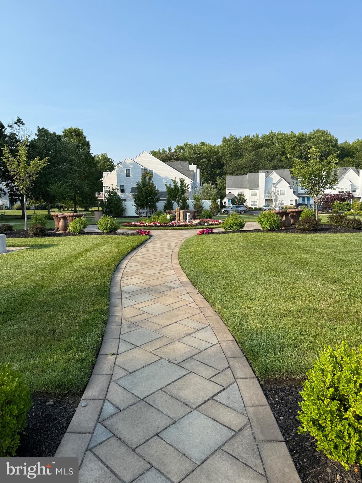 405 Quail Road Marlton, NJ 08053 - Photo 19 of 20 a front view of a house with a yard table and chairs