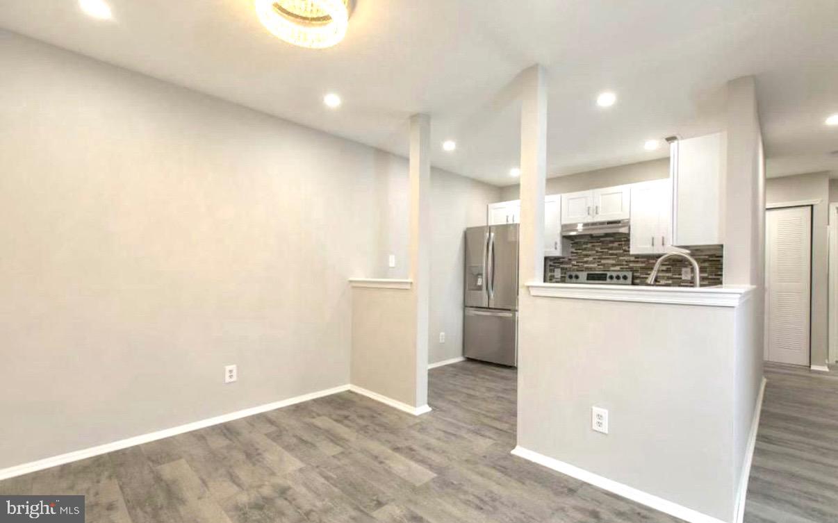 405 Quail Road Marlton, NJ 08053 - Photo 9 of 20 a kitchen with stainless steel appliances a refrigerator and a stove top oven