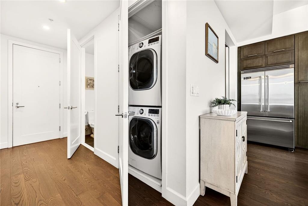 1820 Peachtree Road Northwest, Unit 905 Atlanta, GA 30309 - Photo 22 of 41 a view of a kitchen with washer and dryer