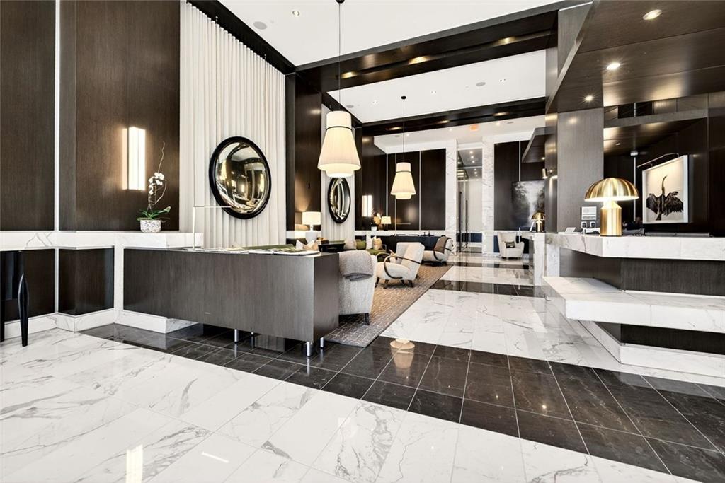 1820 Peachtree Road Northwest, Unit 905 Atlanta, GA 30309 - Photo 26 of 41 a living room with table and chairs