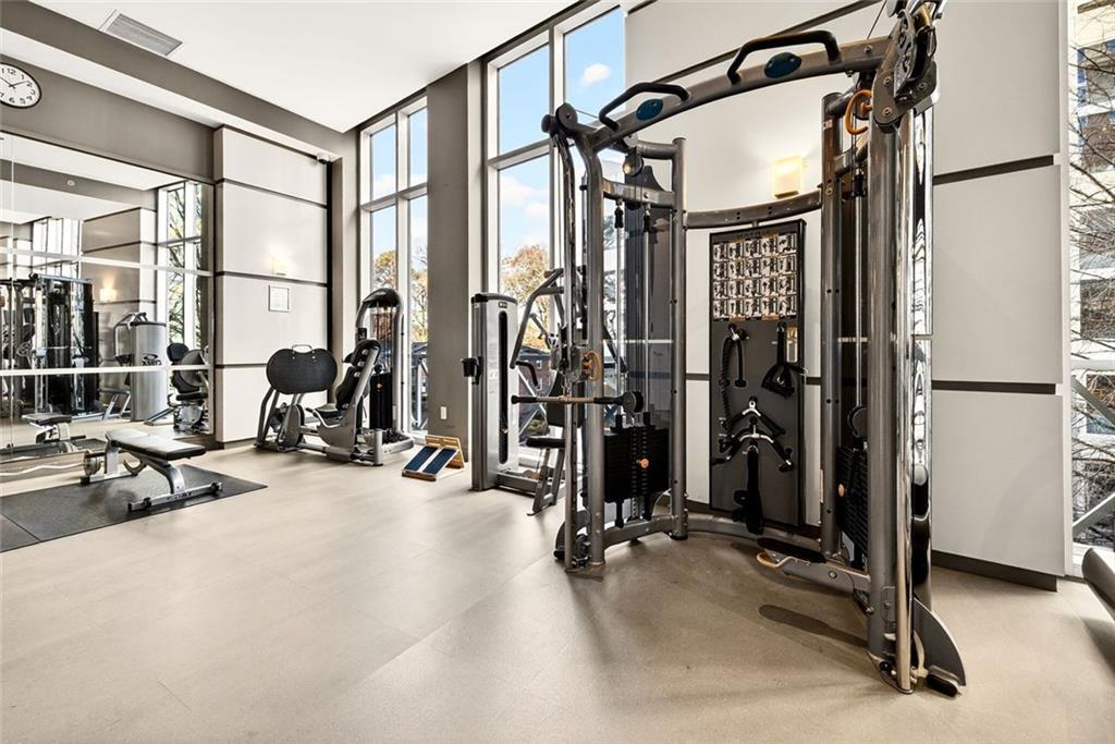 1820 Peachtree Road Northwest, Unit 905 Atlanta, GA 30309 - Photo 31 of 41 a view of a room with gym equipment