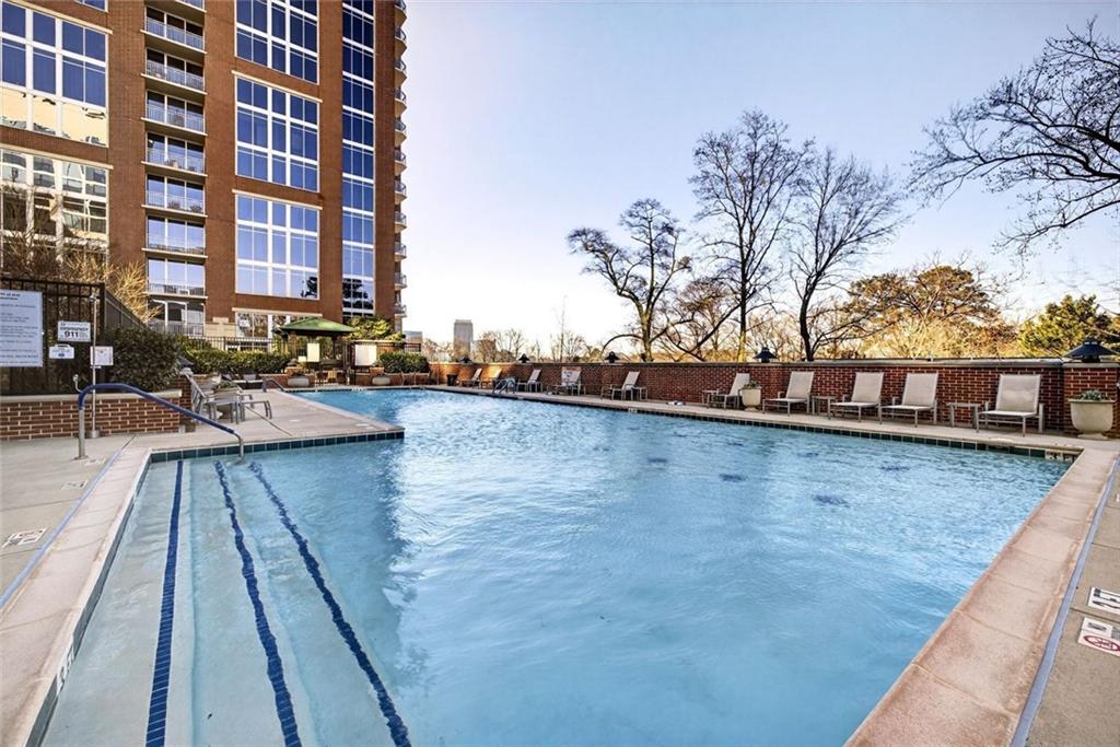 1820 Peachtree Road Northwest, Unit 905 Atlanta, GA 30309 - Photo 33 of 41 a view of swimming pool with outdoor seating