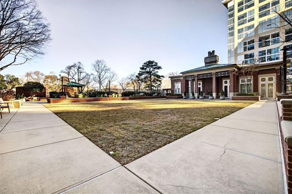 1820 Peachtree Road Northwest, Unit 905 Atlanta, GA 30309 - Photo 40 of 41 a view of a swimming pool with outdoor seating