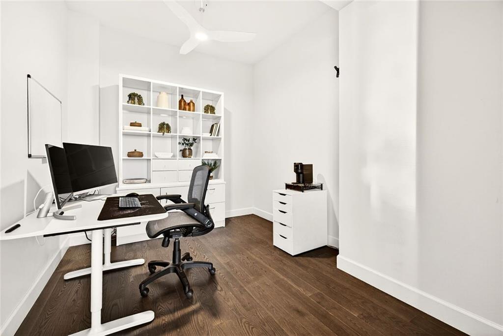 1820 Peachtree Road Northwest, Unit 905 Atlanta, GA 30309 - Photo 7 of 41 a view of a workspace with furniture and wooden floor