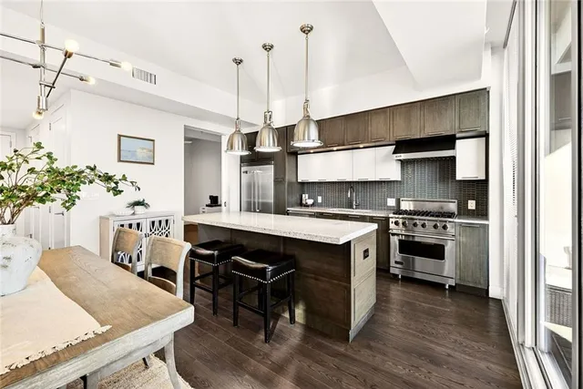 a kitchen with a table and chairs