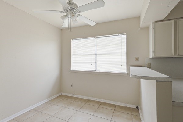 1655 Hawthorne Street Houston, TX 77006 - Photo 24 of 39 an empty room with windows and fan