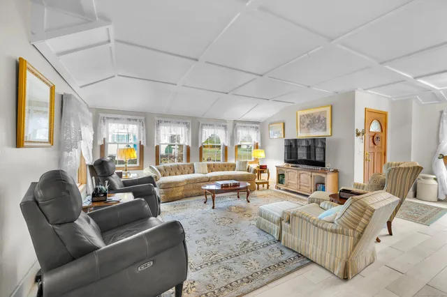 a living room with furniture or couch and a flat screen tv