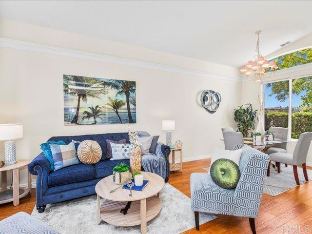 a bedroom with bed and a potted plant