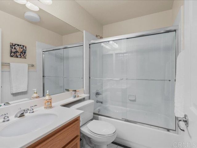 a living room with furniture dining table and a large window