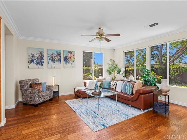 a dining hall with stainless steel appliances granite countertop a stove and a refrigerator