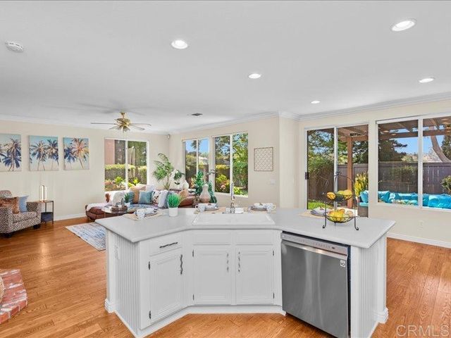 a stove top oven sitting inside of a kitchen