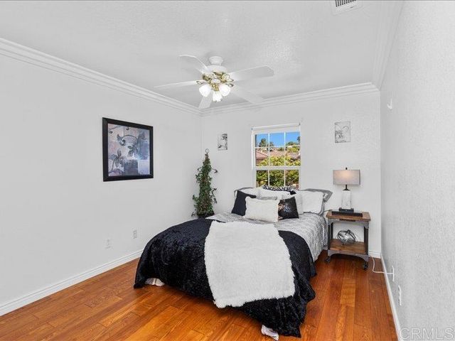 a view of a porch with furniture and garden
