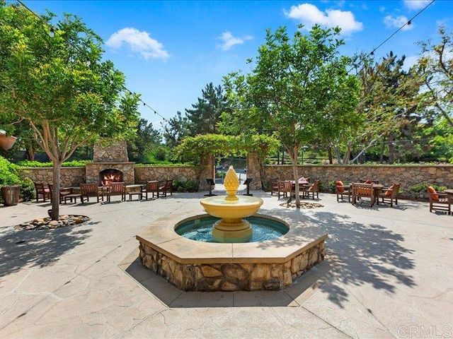 a house with a yard and large trees