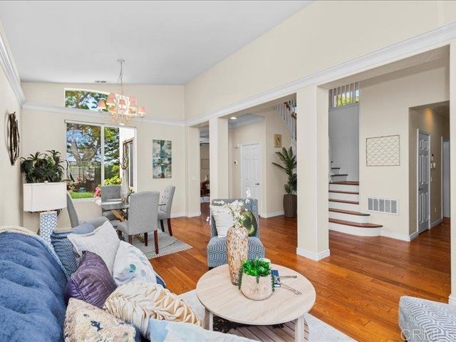 a living room with furniture and a table