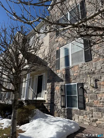 a front view of a house with parking space