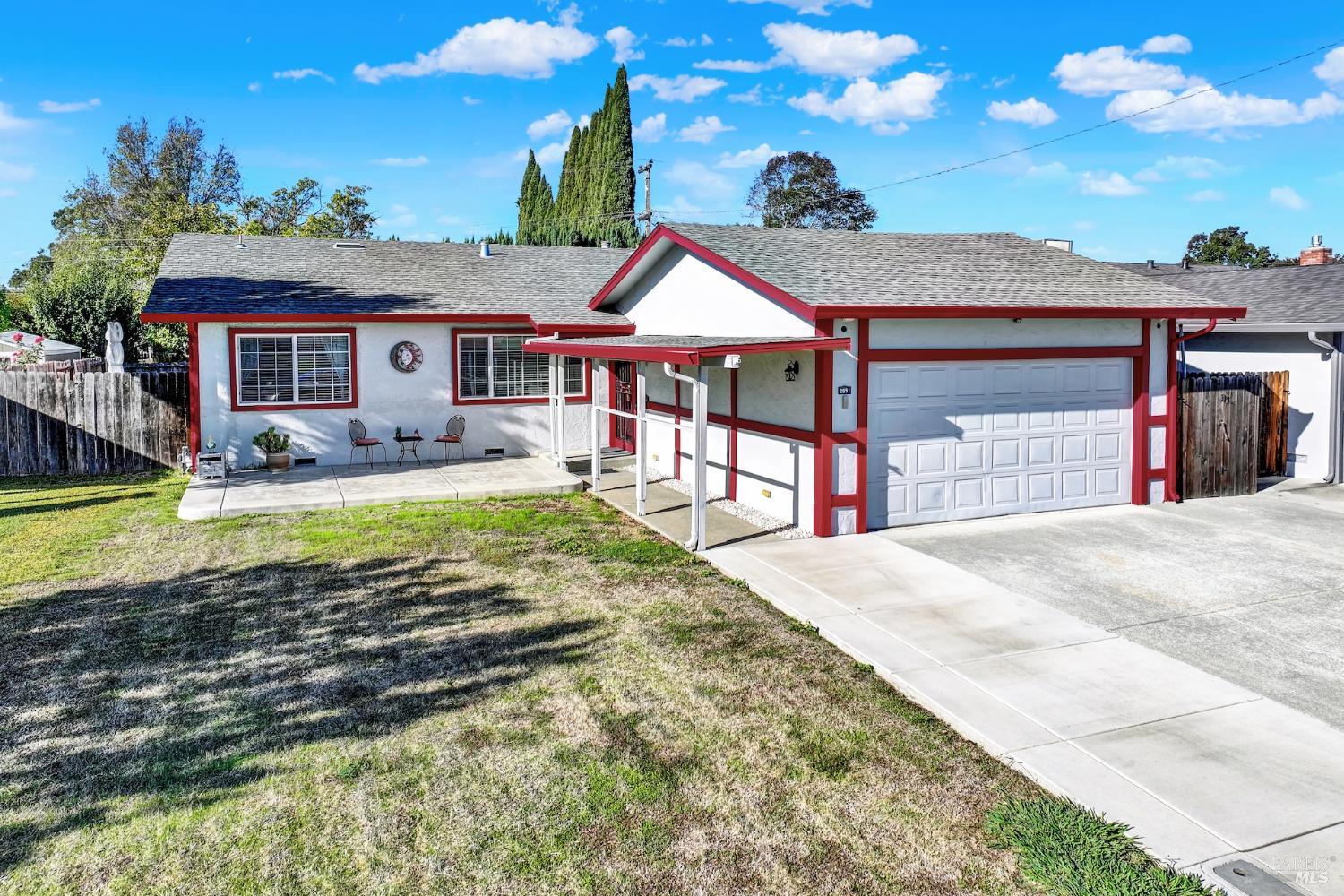 a view of a house with swimming pool and a yard