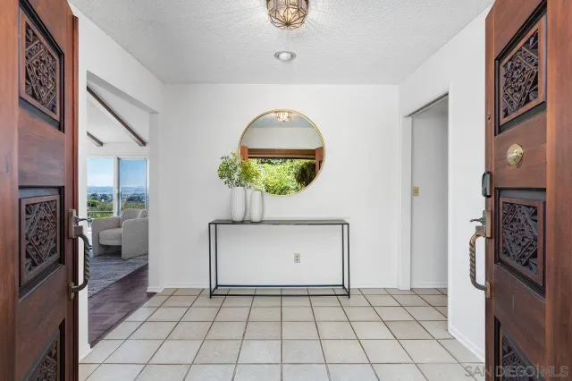 a view of an entryway and livingroom