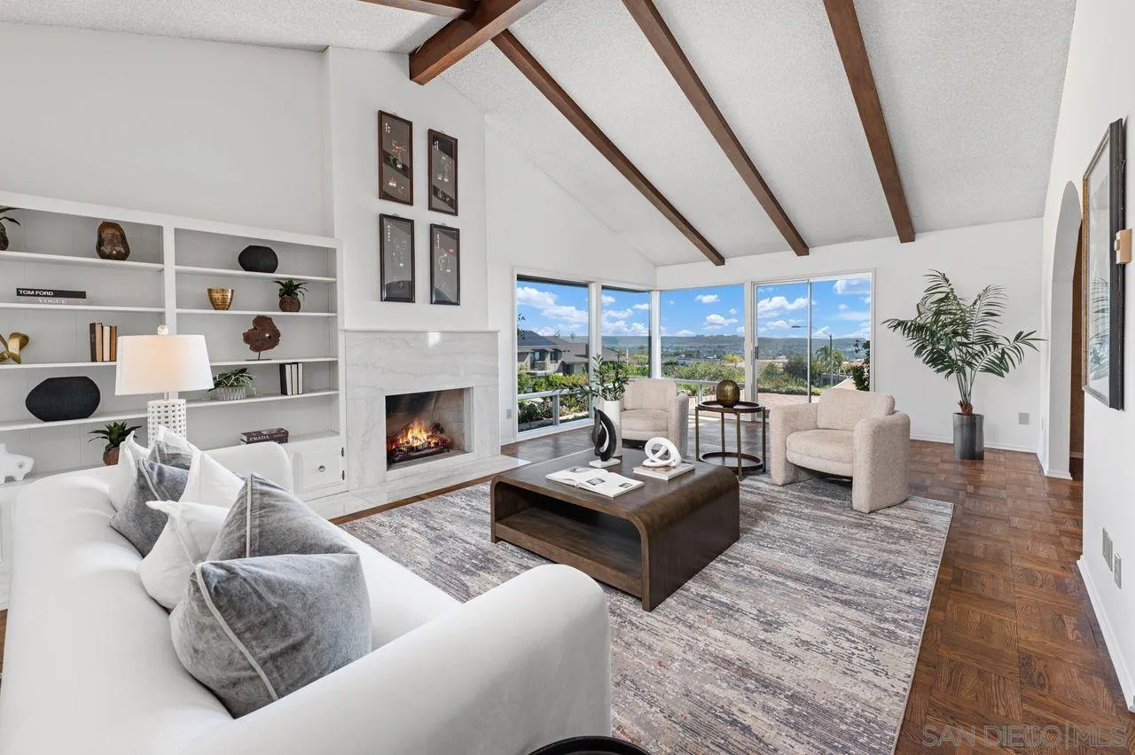 5504 Rutgers Road La Jolla, CA 92037 - Photo 14 of 53 a living room with furniture large window and a fireplace