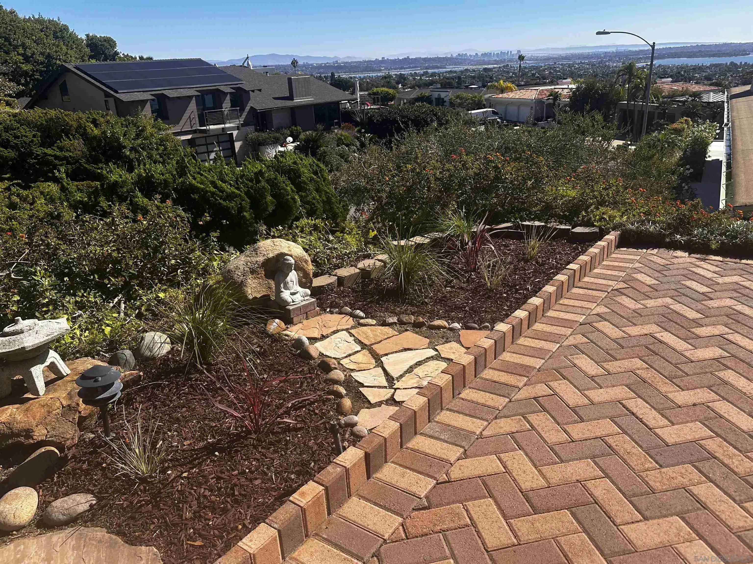 5504 Rutgers Road La Jolla, CA 92037 - Photo 17 of 53 a view of a yard with plants and large trees