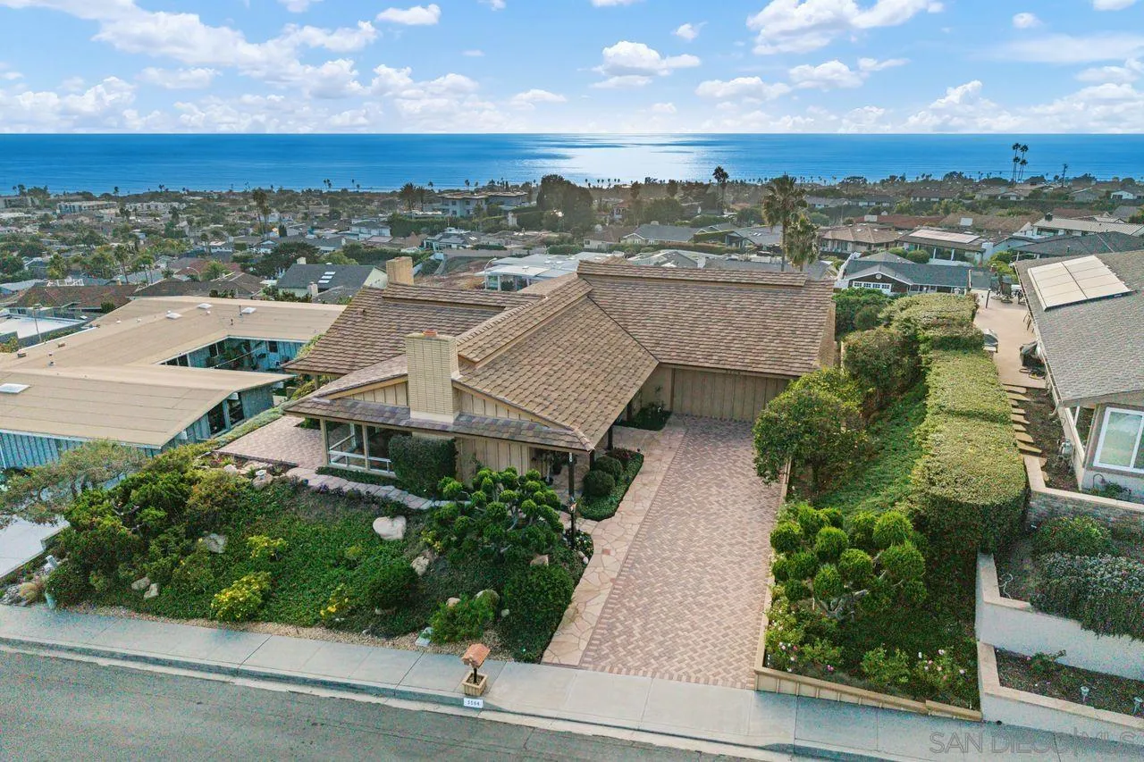5504 Rutgers Road La Jolla, CA 92037 - Photo 2 of 53 an aerial view of a house with a yard and lake view
