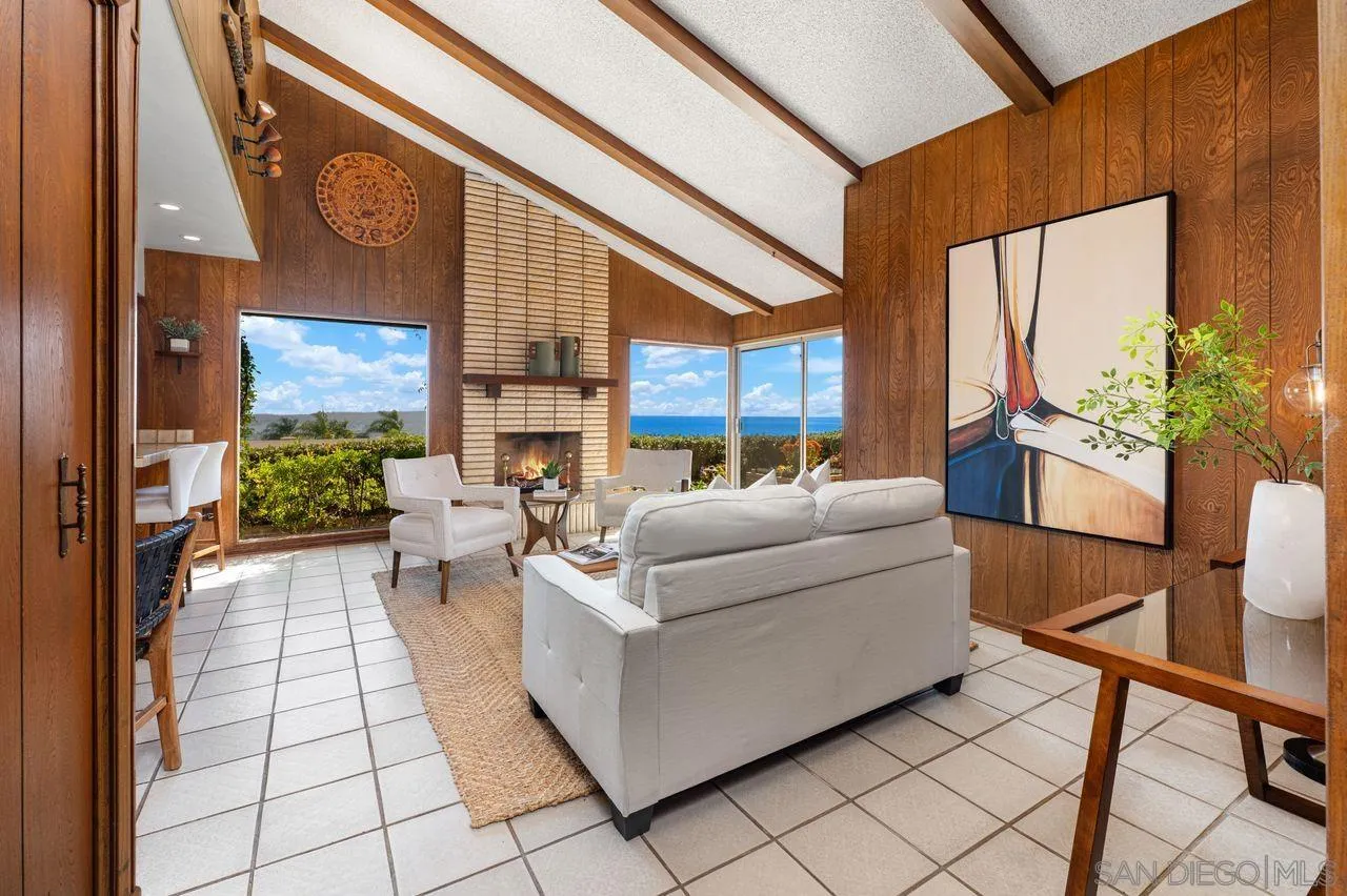 5504 Rutgers Road La Jolla, CA 92037 - Photo 24 of 53 a living room with furniture and a large window