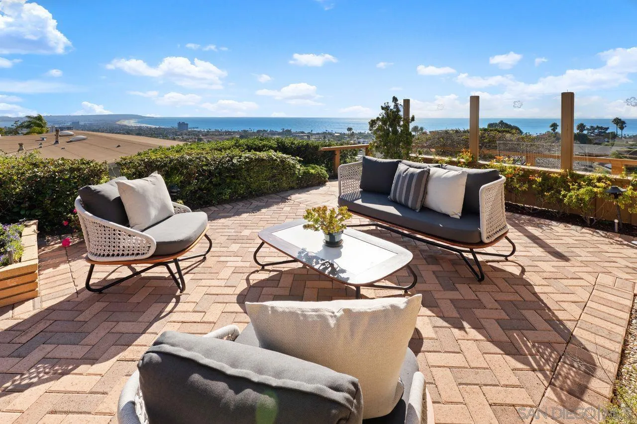 5504 Rutgers Road La Jolla, CA 92037 - Photo 28 of 53 a view of a terrace with furniture and a garden