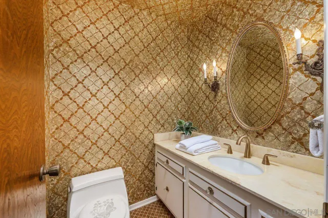 a kitchen with stainless steel appliances a white cabinets and a stove