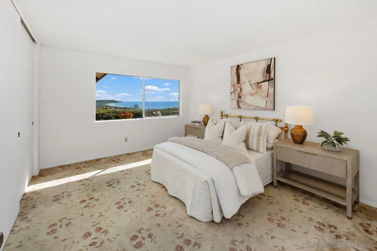 5504 Rutgers Road La Jolla, CA 92037 - Photo 37 of 53 a bedroom with a bed and a painting on the wall