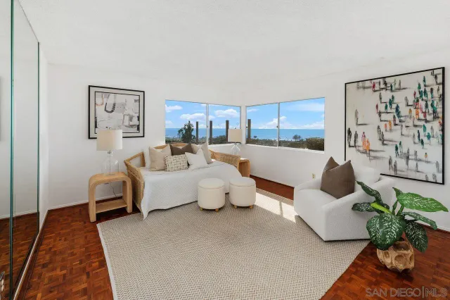 a bedroom with a large bed and a large window