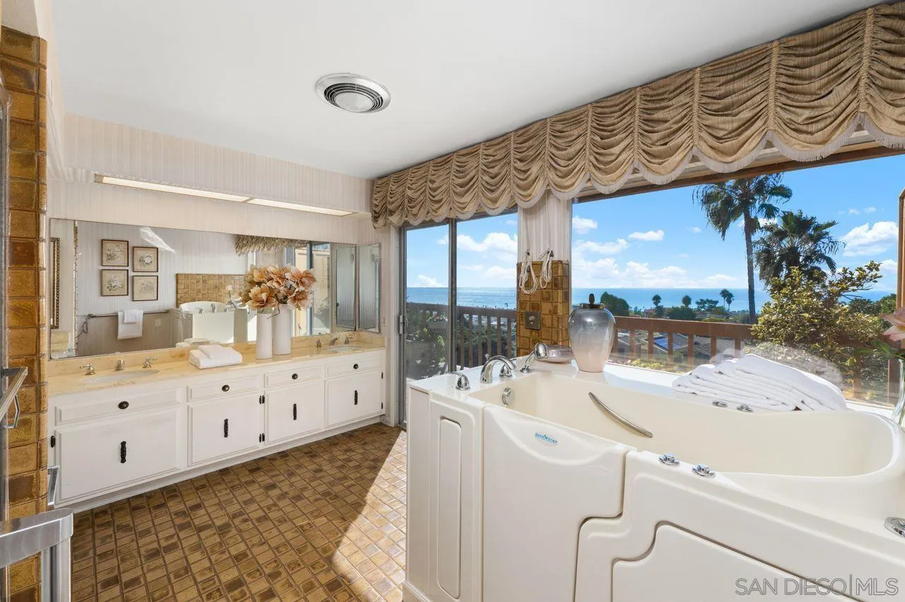 5504 Rutgers Road La Jolla, CA 92037 - Photo 45 of 53 a large white kitchen with a large window