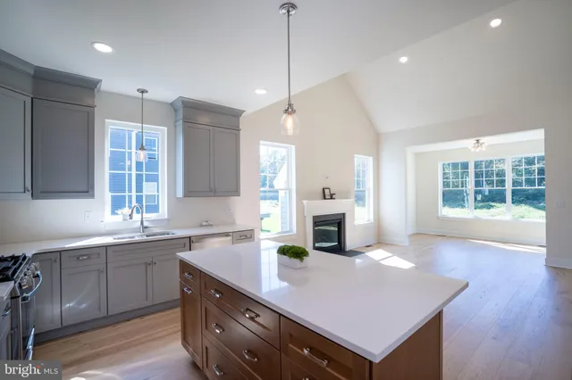 a kitchen with stainless steel appliances a sink stove and microwave