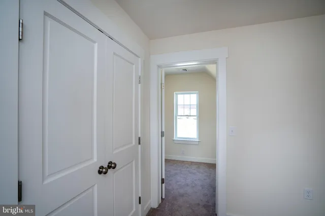 an empty room with a empty space and windows