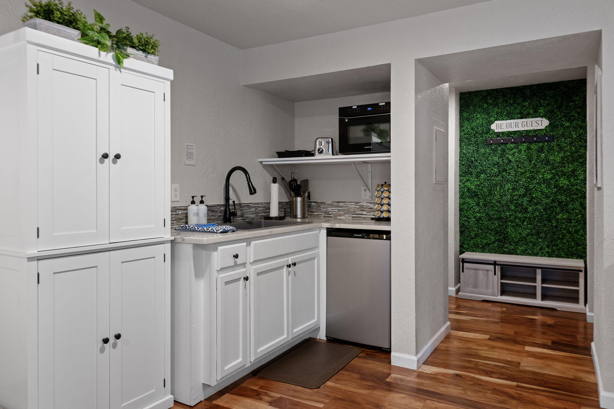 17654 Pinnacle Lane, Unit 16 Sunriver, OR 97707 - Photo 14 of 28 a kitchen with a sink and cabinets
