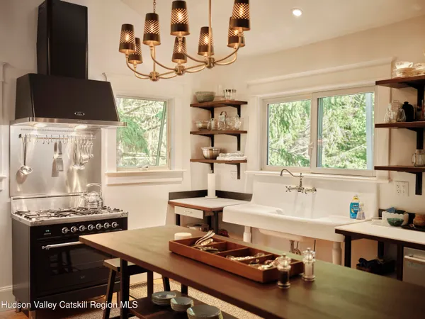 a kitchen with a stove and a white refrigerator