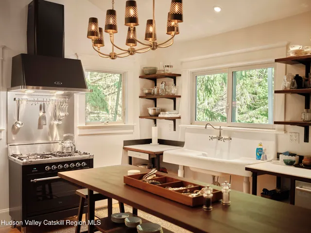 a kitchen with a stove and a white refrigerator