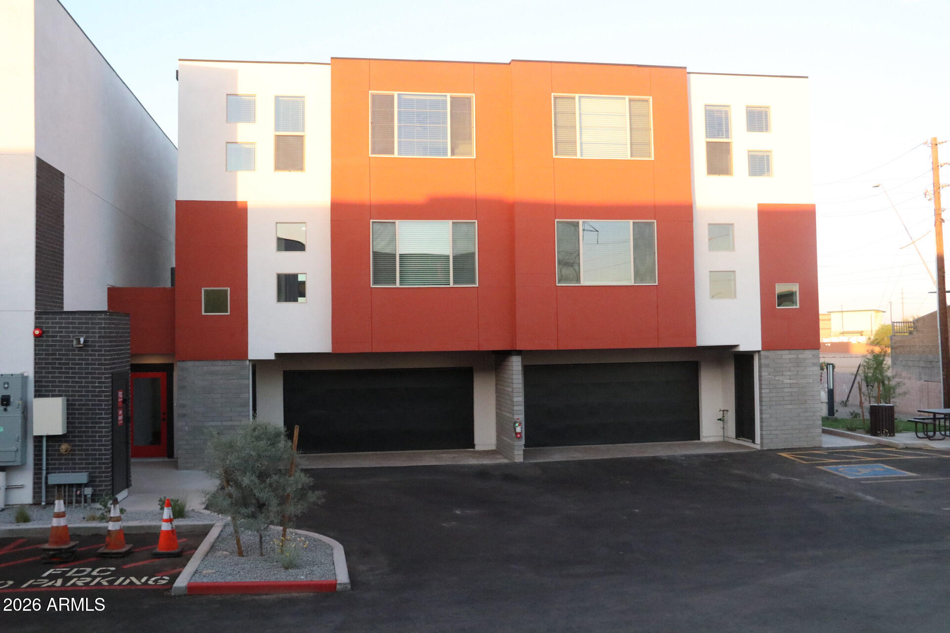 630 North Power Road, Unit 102 Mesa, AZ 85205 - Photo 1 of 13 a front view of a building with a yard