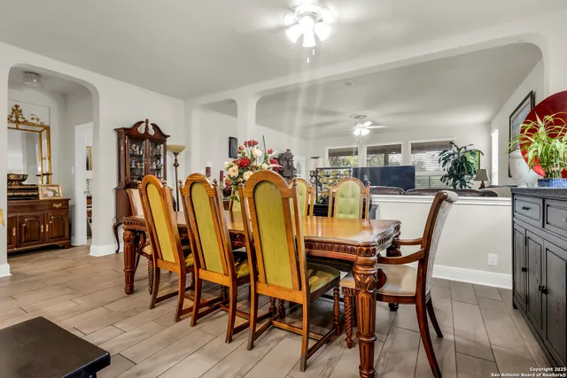 a dining room with furniture and window