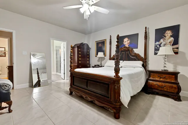 a room with a bed and a chandelier