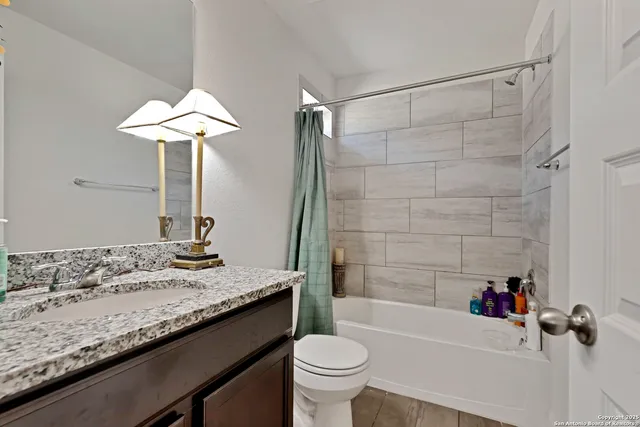 a bathroom with a sink a toilet and a bathtub